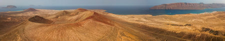 Aerial view of Caleta de Sebo, the main settlement and capital community of La Graciosa, Canary Islands. In the background El risco, the mountainous part to the north of Lanzaroteの写真素材