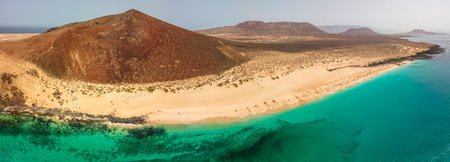 Aerial view of the Playa de las Conchas and mountain Bermeja, La Graciosa island in Lanzarote, Canary island. Spain. Ocean view and sand beachの写真素材