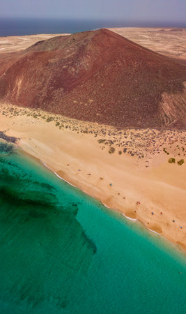 Aerial view of the Playa de las Conchas and mountain Bermeja, La Graciosa island in Lanzarote, Canary island. Spain. Ocean view and sand beachの写真素材
