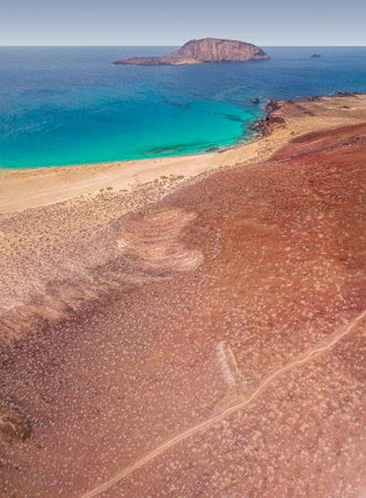 Aerial view of the Playa de las Conchas and mountain Bermeja, La Graciosa island in Lanzarote, Canary island. Spain. Ocean view and sand beachの写真素材