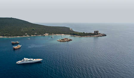 Aerial view of the Boka Kotorska, entrance into the fjord of Montenegro leading to the city of Kotor. Bay of Kotor. Yacht and boats line the wild and jagged coasts. Zanjicの写真素材