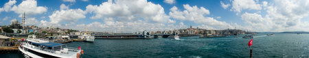 Panoramic view of the Istanbul skyline from a sailing boat on the Bosphorus. Mosques, historic...