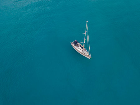 Aerial view of a sailboat moored off the coast of Calabria in Tropea. Italy. Tyrrhenian Sea. Coastline of Calabriaのeditorial素材