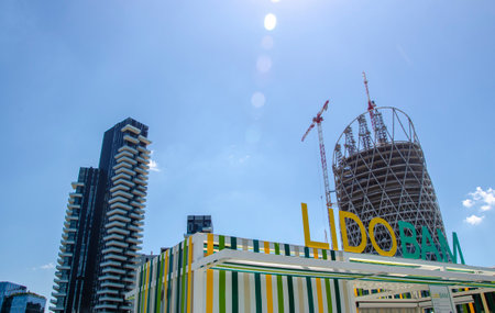 View of Lido BAM, park located between Piazza Gae Aulenti and the Isola district. City center and skyscrapers, Solaria Tower and UnipolSai tower. 06-26-2021. Milan. Italyのeditorial素材