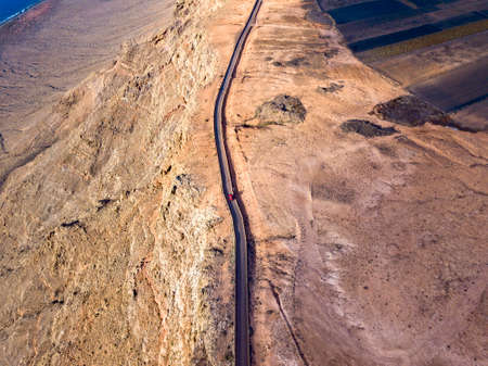 Aerial view from the north tip of the island of Lanzarote, view of the road leading to the Mirador del Rio. Jagged coasts and cliffs overlooking the ocean. Canary Islands, Spainの写真素材
