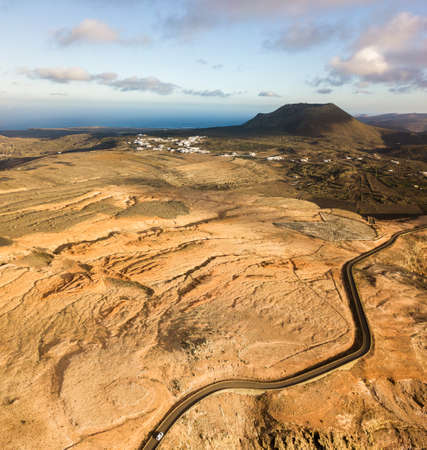 Aerial view from the north tip of the island of Lanzarote, view of the road leading to the Mirador del Rio. Jagged coasts and cliffs overlooking the ocean. Canary Islands, Spainの写真素材