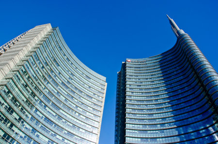 Architecture, new architectural forms, lines and new buildings. Design of buildings in the heart of Milan. Skyscrapers and buildings in Piazza Gae Aulenti. Unicredit tower. 02-02-2022. Italyのeditorial素材