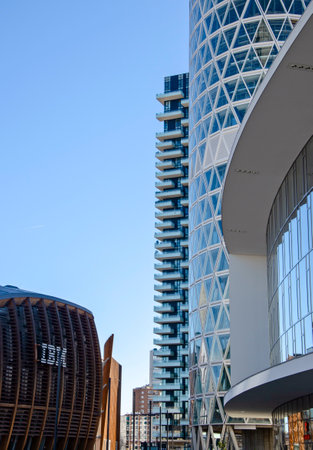 Architecture, new architectural forms, lines and new buildings. Design of buildings in the heart of Milan. Skyscrapers and buildings close Piazza Gae Aulenti. Unipol tower, Solaria Tower, 02-02-2022.のeditorial素材