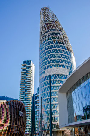 Architecture, new architectural forms, lines and new buildings. Design of buildings in the heart of Milan. Skyscrapers and buildings close Piazza Gae Aulenti. Unipol tower, Solaria Tower, 02-02-2022.のeditorial素材