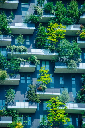 View of the balconies and terraces of Bosco Verticale, full of green plants. Spring time. 05-09-2022. Milan, Porta Nuova skyscraper residences, Italyのeditorial素材
