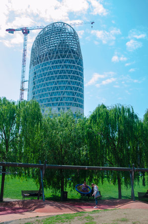 nipol tower seen from the Biblioteca degli Alberi (BAM), park located between Piazza Gae Aulenti and the Isola district. 05-09-2022. Flowering fields. Milan. Italyのeditorial素材