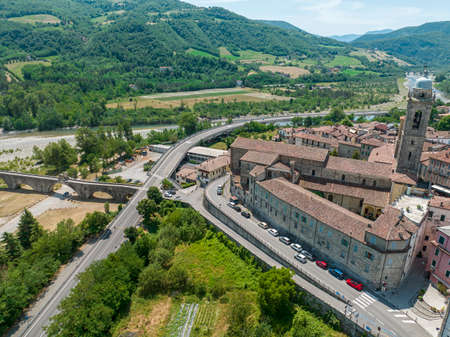 Aerial view of Bobbio, a town on the Trebbia river. Bridge. Piacenza, Emilia-Romagna. Details of the urban complex, roofs and bell towers of the townの写真素材