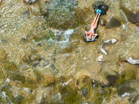 Aerial view of people bathing in the Trebbia river in the town of Bobbio, Piacenza, Emilia-Romagna. Italy.のeditorial素材
