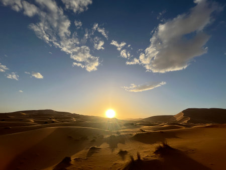 Dunes in the Sahara desert, Merzouga desert, grains of sand forming small waves on the dunes, panoramic view. Setting sun. Moroccoの写真素材