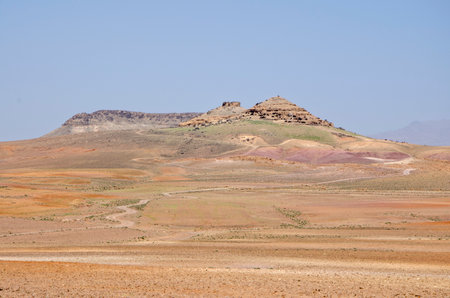 Desert landscapes in Morocco, desolate lands with paths that lead to remote and unexplored corners. Climate change and arid climate. Desertification and lack of water. Mountainsの写真素材