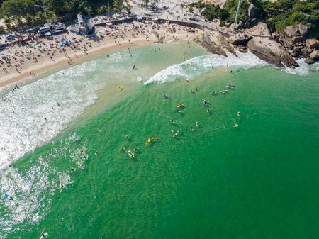 Aerial view of Diabo beach and Ipanema beach, Pedra do Arpoador. People sunbathing and playing on...