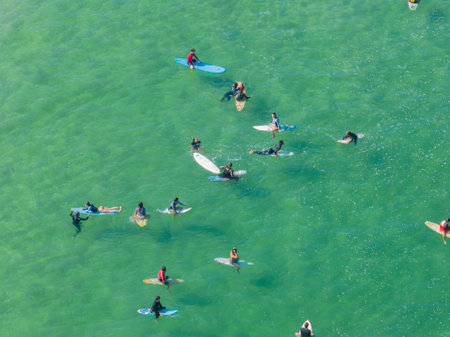 Aerial view of surfers in the water, Ipanema beach. Atlantic Ocean waves. 06-07-2023, Rio de Janeiro, Brazilのeditorial素材