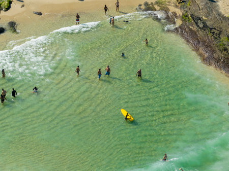 Aerial view of surfers in the water, Ipanema beach. Atlantic Ocean waves. 06-07-2023, Rio de...