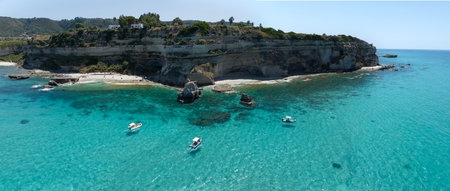 Aerial view of Petri i Mulinu beach and Skeleton Cave, Tropea, Calabria, Italy. Promontory overlooking the sea, panoramic view. transparent seaの写真素材
