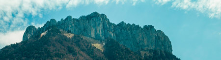 Aerial view of mountains and green landscapes around the castle of Menthon-Saint-Bernard, paths surrounded by greenery and snow-capped peaks. in the Haute-Savoie department of Franの写真素材