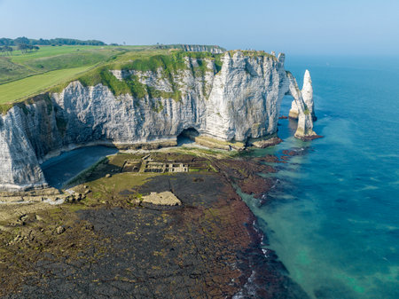 Aerial view of Etretat cliffs and the Atlantic ocean. Chalk cliffs and three natural arches. Panoramic path to admire the coast. Normandy region of Northwestern France. 06-26-2024の写真素材