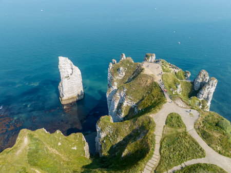 Aerial view of Etretat cliffs and the Atlantic ocean. Chalk cliffs and three natural arches. Panoramic path to admire the coast. Normandy region of Northwestern France. 06-26-2024の写真素材