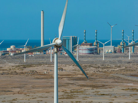 Renewable energy, wind energy, wind turbines moving, near the ocean. Renewable electricity. Power...