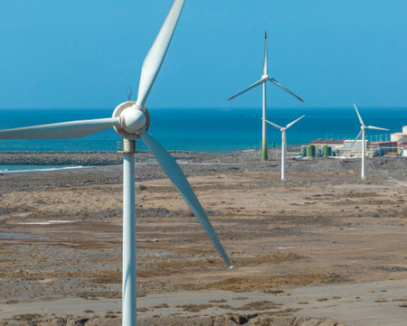 Renewable energy, wind energy, wind turbines moving, near the ocean. Renewable electricity. Power supply. Gran Canariaの写真素材