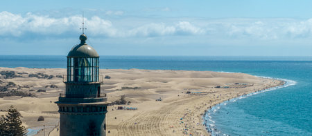 Maspalomas lighthouse and sand dunes, Gran Canaria, Spain.The seafront at Punta de Maspalomas, is dominated by a 56-metre-high lighthouse, El Faro de Maspalomasの写真素材