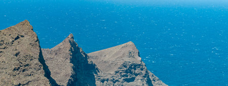 Aerial view from Mirador del Balcon, mountains and cliffs overlooking the ocean, winding roads. Gran Canaria, Spainの写真素材