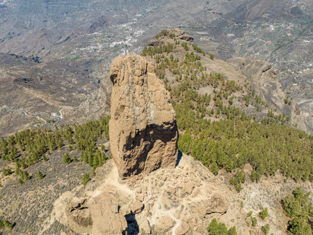 Aerial view of Roque Nublo, Gran Canaria. Large volcanic formation in Gran Canaria. Spain. In the background the island of Tenerife with Teide the volcano.の写真素材
