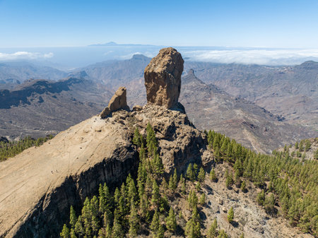 Aerial view of Roque Nublo, Gran Canaria. Large volcanic formation in Gran Canaria. Spain. In the background the island of Tenerife with Teide the volcano.の写真素材
