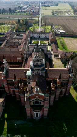 Aerial view of the Certosa di Pavia, built in the late fourteenth century, courts and the cloister of the monastery and shrine in the province of Pavia, Lombardia, Italyの写真素材