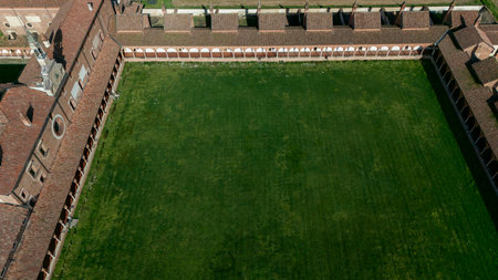 Aerial view of the Certosa di Pavia, built in the late fourteenth century, courts and the cloister of the monastery and shrine in the province of Pavia, Lombardia, Italyの写真素材