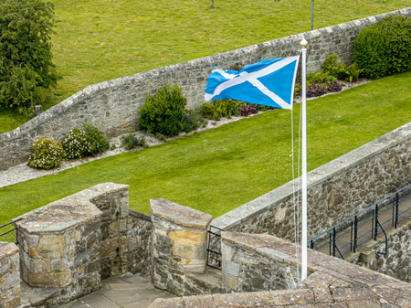 Aerial view of a Scottish flag flying over the Blackness Castle. It is a 15th-century fortress, Scotland, on the south shore of the Firth of Forth. Set of the TV series Outlanderの写真素材