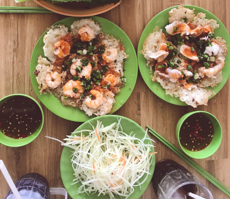 Fried rice with shrimps on wooden table, top viewの写真素材
