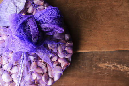 garlic on wooden table backgroundの写真素材