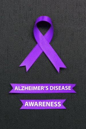 Purple ribbon. Alzheimer's disease awareness. Healthcare and medicine concept.の写真素材
