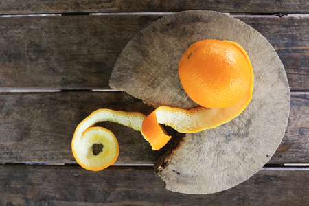 Orange fruit on wooden table backgroundの写真素材