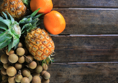 Fruits on wooden table backgroundの写真素材