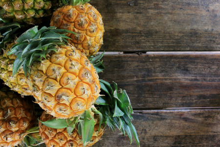 Pineapple on wooden grunge backgroundの写真素材