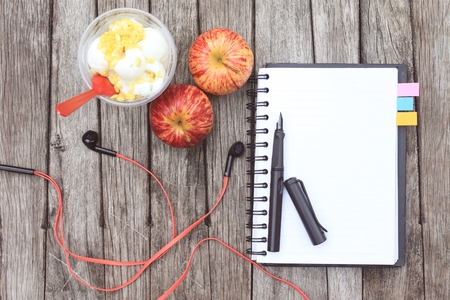 open blank book on wooden table backgroundの写真素材
