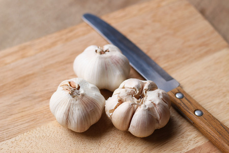 garlic on a cutting boardの写真素材