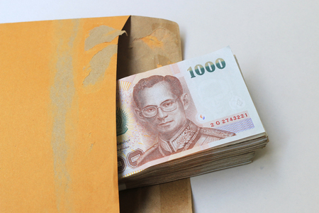 Thai money in brown envelopの写真素材