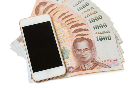 smartphone and money isolated on a white background.の写真素材