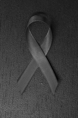 Black ribbon. melanoma awareness. Mourning symbol.
