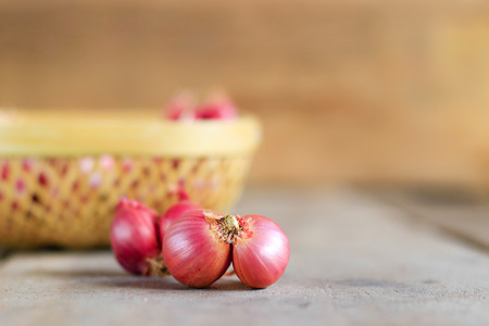 red onion on wooden table backgroundの写真素材