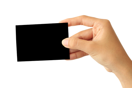 Woman hand holding blank black paper card isolated on white backgroundの写真素材
