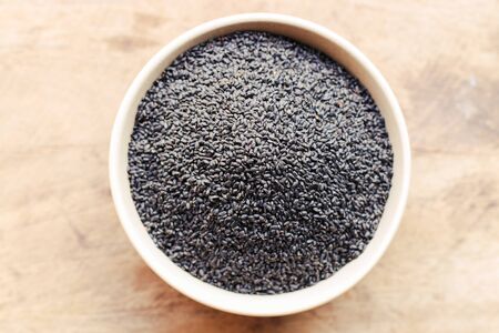 Black Sesame close up shot on wood backgroundの写真素材