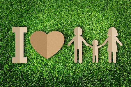 Paper cut of family on green grassの写真素材